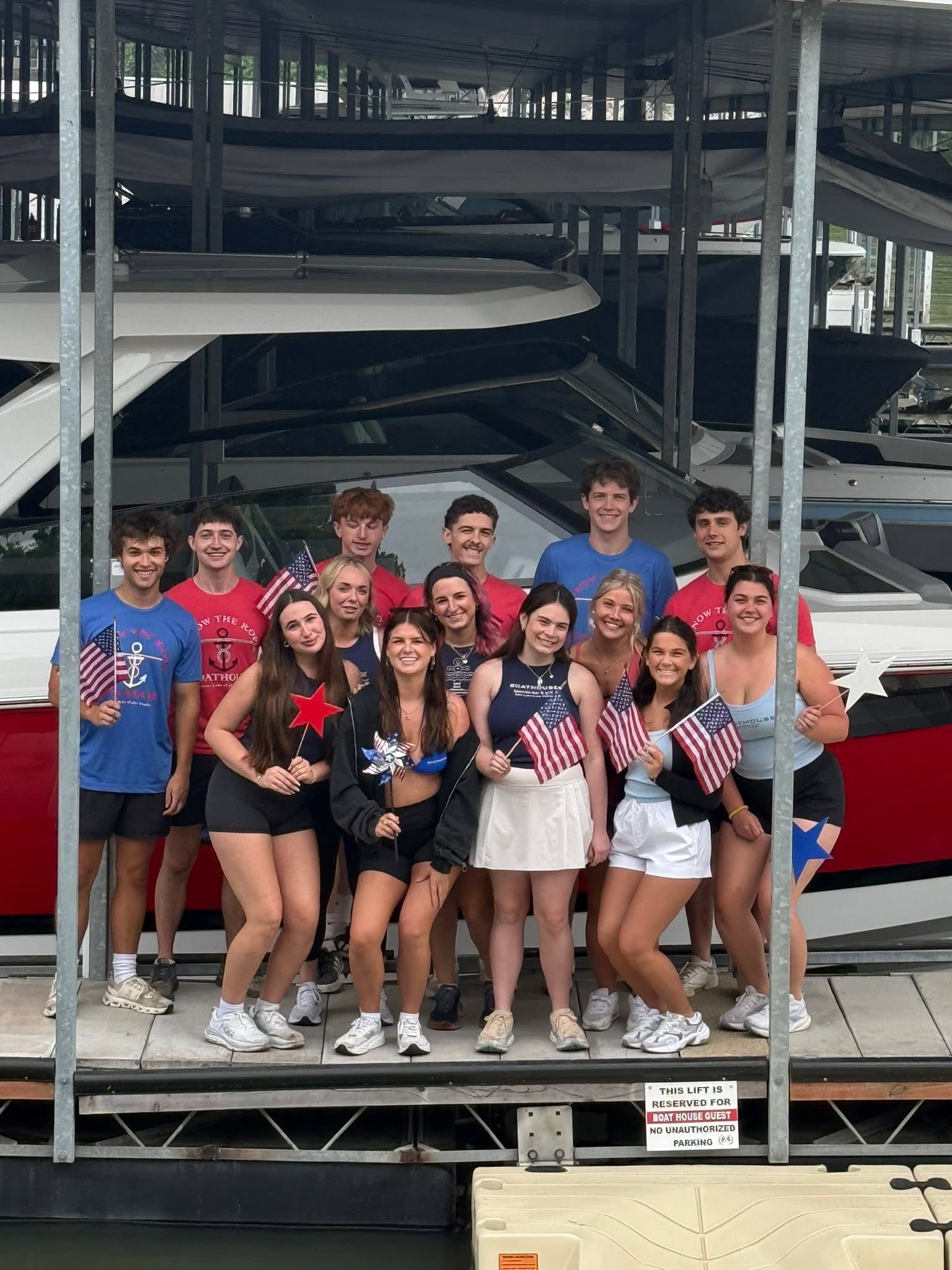 The Boathouse crew celebrating the Fourth of July by the docks