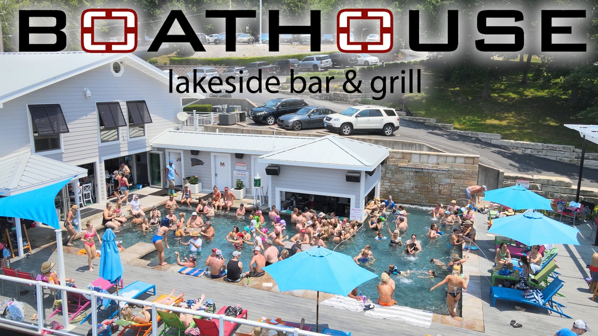 Aerial view of a busy summer day at the Boathouse pool